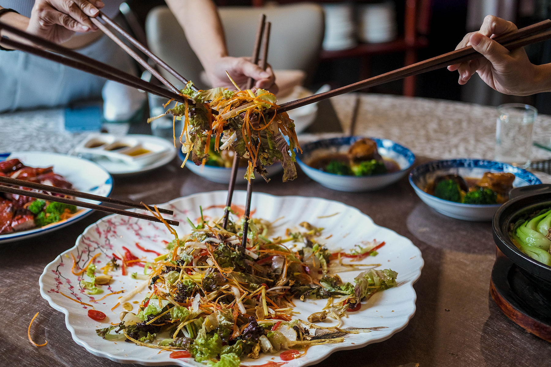 It’s not Chinese New Year without a messy lou sang session!